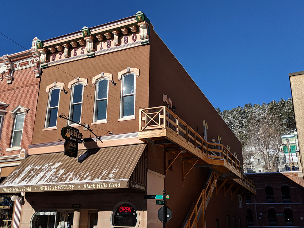 Historic Cornice and Historic Doors, Windows, and Casework.